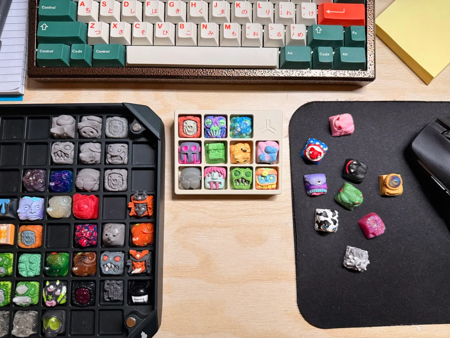 A grid of small hand-sculpted resin keycaps in bright colors
